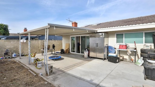 rear view of property featuring a patio area