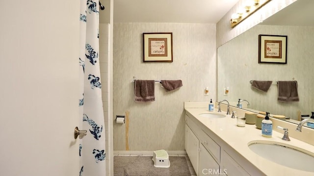 bathroom with tile patterned floors and vanity