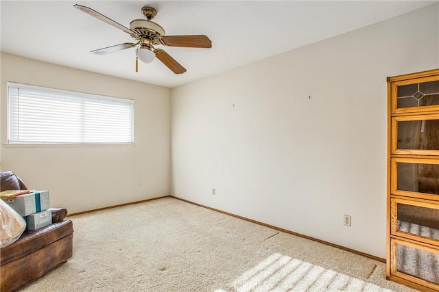 sitting room with light carpet and ceiling fan