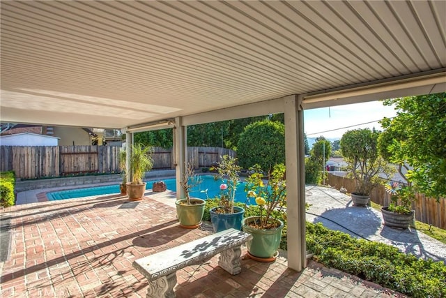 view of patio featuring a fenced in pool