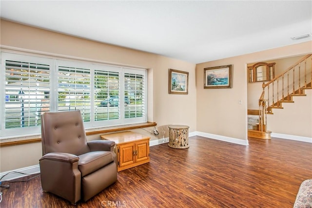 living area with dark hardwood / wood-style flooring