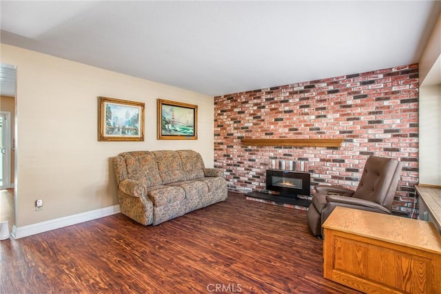 living room with dark hardwood / wood-style floors and a fireplace