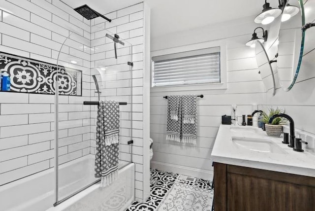 full bathroom featuring vanity, toilet, and enclosed tub / shower combo