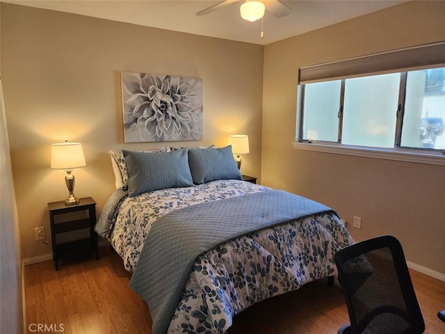 bedroom featuring ceiling fan and light wood-type flooring