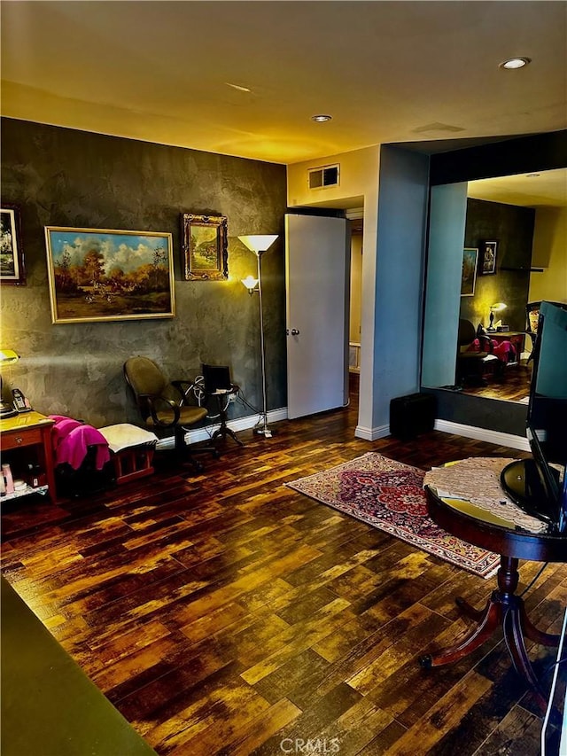 sitting room featuring dark hardwood / wood-style floors