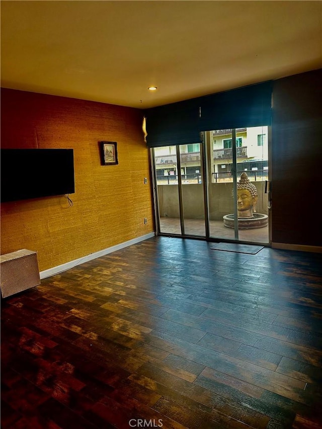 unfurnished room featuring hardwood / wood-style flooring