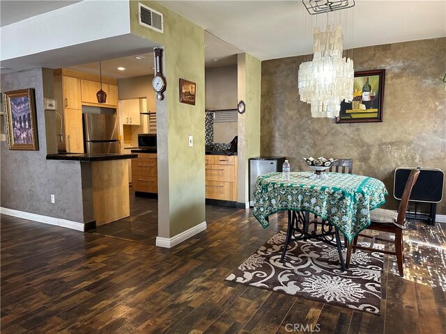 dining space featuring dark hardwood / wood-style floors