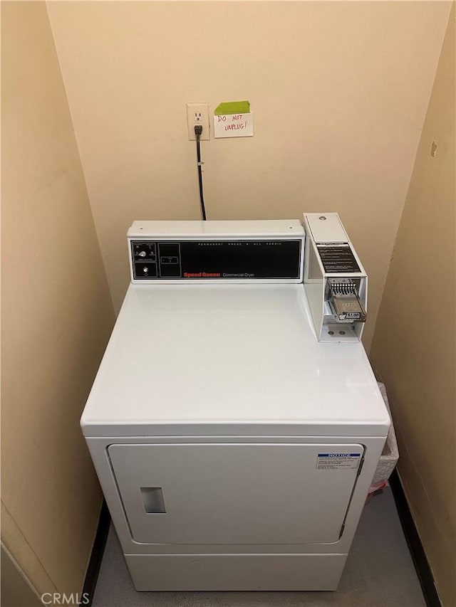 clothes washing area with washer / dryer