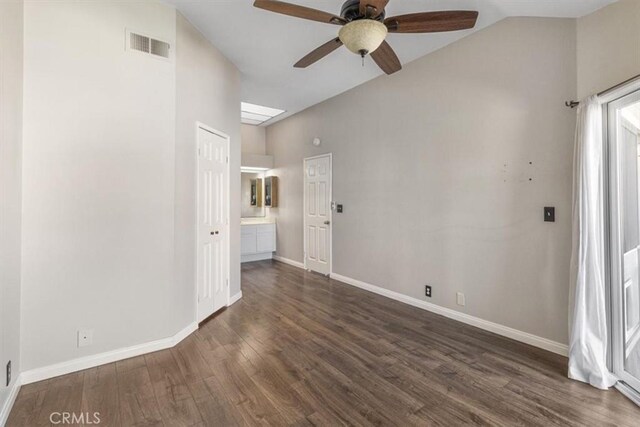 spare room featuring lofted ceiling, ceiling fan, and dark hardwood / wood-style floors