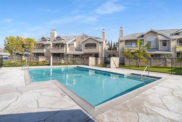 view of swimming pool with a patio