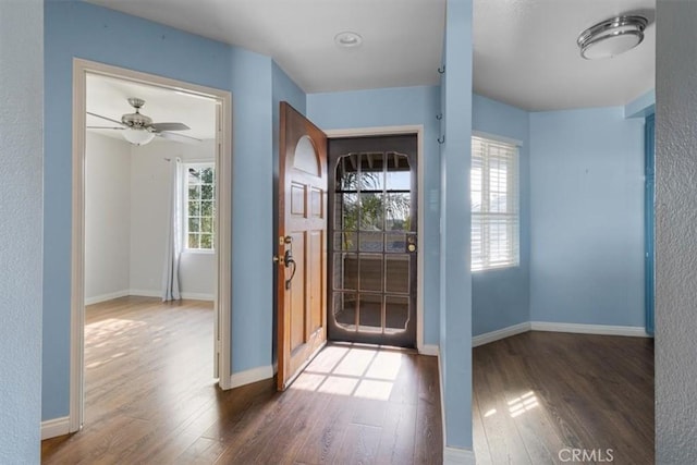 entryway featuring ceiling fan and dark hardwood / wood-style floors