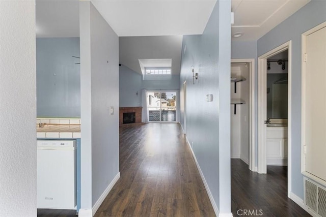 hall with dark wood-type flooring