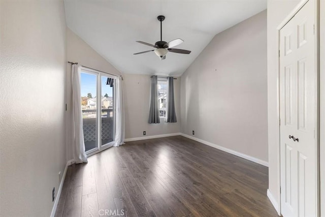 unfurnished room with ceiling fan, dark hardwood / wood-style flooring, and lofted ceiling