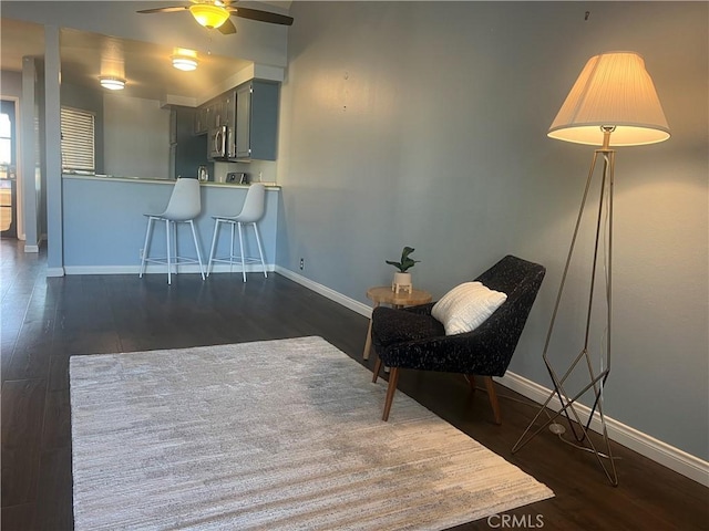 unfurnished room with ceiling fan and dark hardwood / wood-style flooring