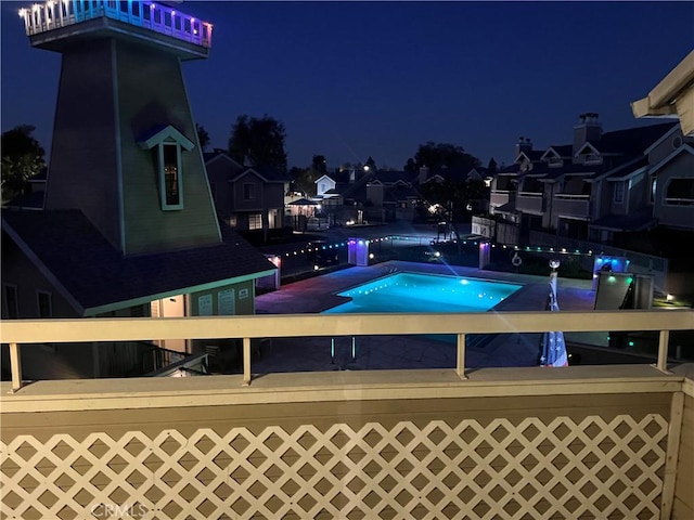 view of pool at night