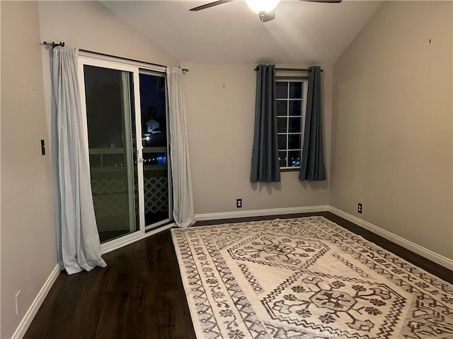 empty room featuring ceiling fan, hardwood / wood-style flooring, and lofted ceiling