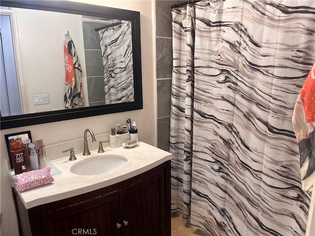 bathroom with vanity and walk in shower