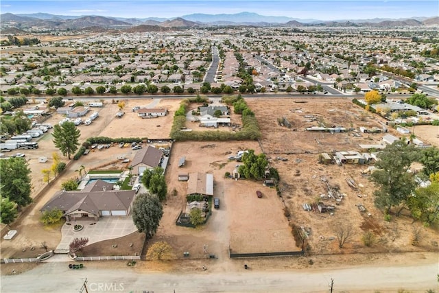 birds eye view of property featuring a mountain view