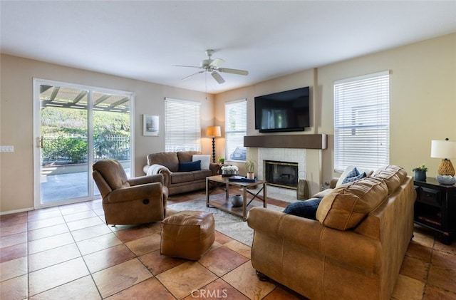 living room featuring ceiling fan and a healthy amount of sunlight