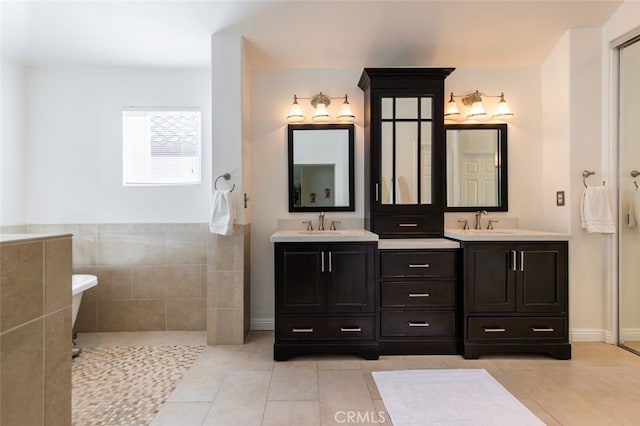 full bath with tile patterned floors, vanity, and baseboards