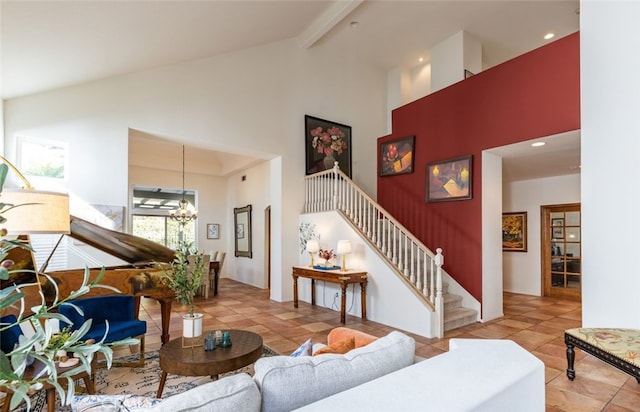 tiled living room featuring beamed ceiling, a notable chandelier, and high vaulted ceiling