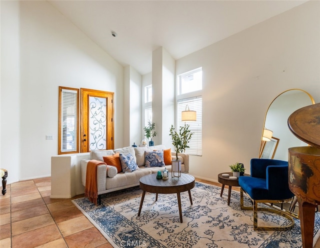 living room with high vaulted ceiling