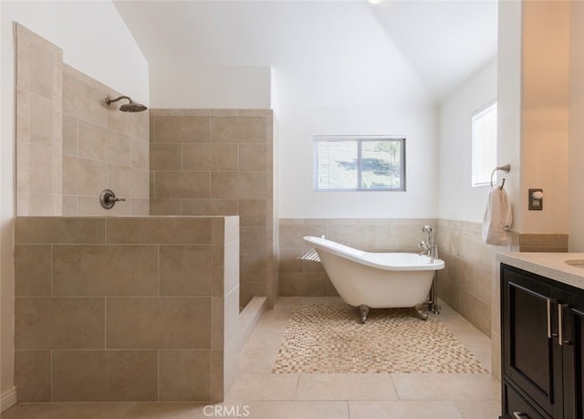 bathroom featuring tile patterned floors, separate shower and tub, tile walls, and vaulted ceiling