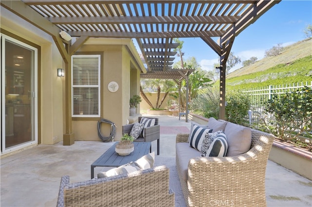 view of patio featuring an outdoor hangout area, a pergola, and fence