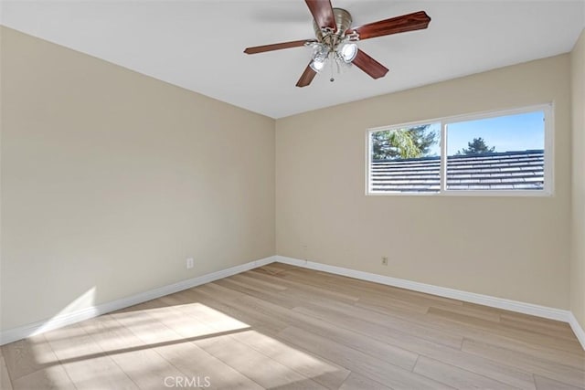 unfurnished room featuring light wood-type flooring and ceiling fan