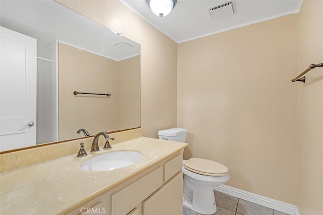 bathroom with toilet, tile patterned flooring, walk in shower, and vanity