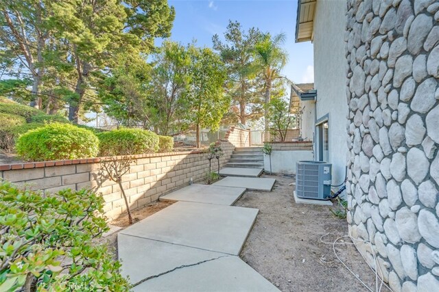 view of yard with a patio and central AC