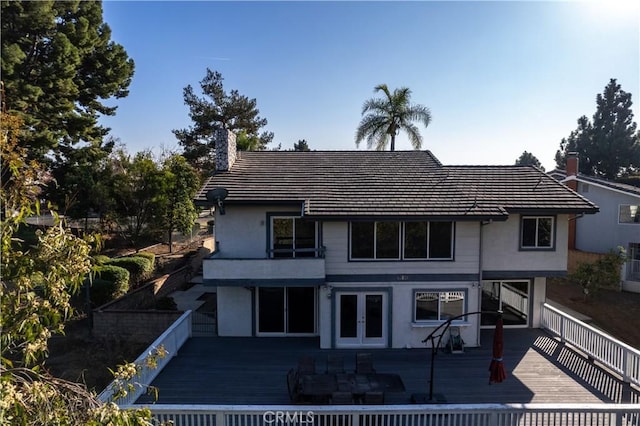 view of front of property featuring french doors and a deck