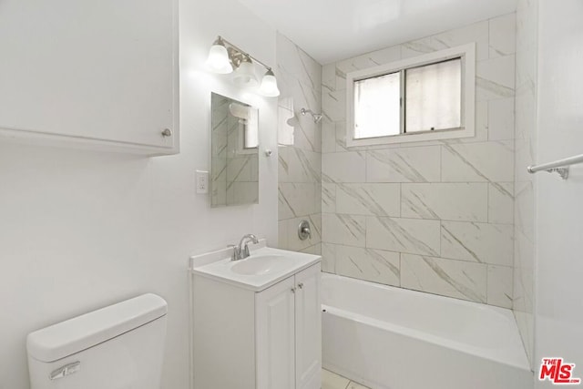 full bathroom featuring vanity, toilet, and tiled shower / bath combo