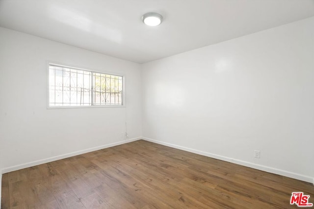 empty room featuring wood-type flooring