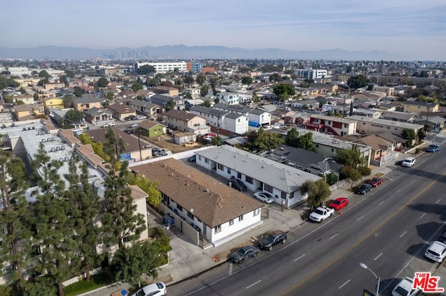 birds eye view of property featuring a mountain view