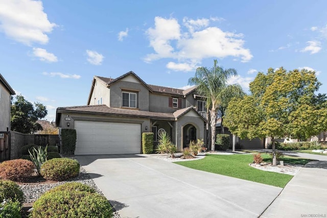 view of front facade with a front yard and a garage