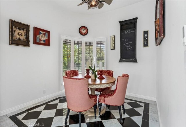 tiled dining room featuring ceiling fan