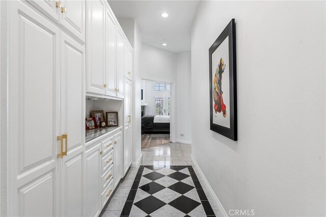 hallway featuring light tile patterned floors