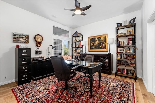 office space featuring light hardwood / wood-style flooring and ceiling fan