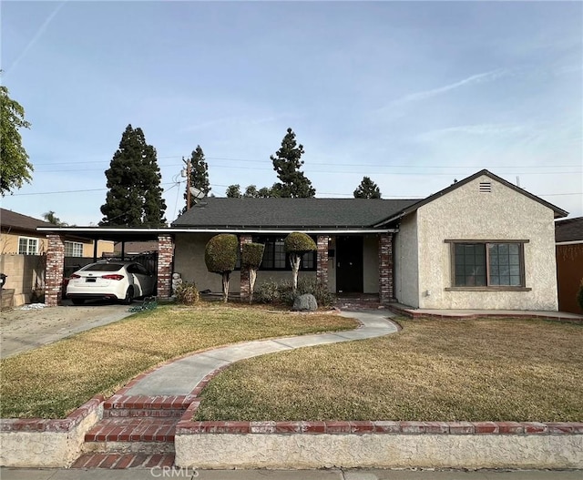 ranch-style house with a carport and a front yard