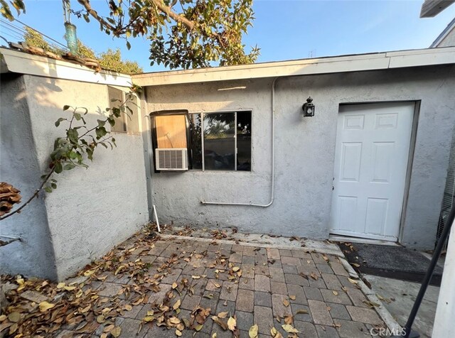 doorway to property featuring a patio area