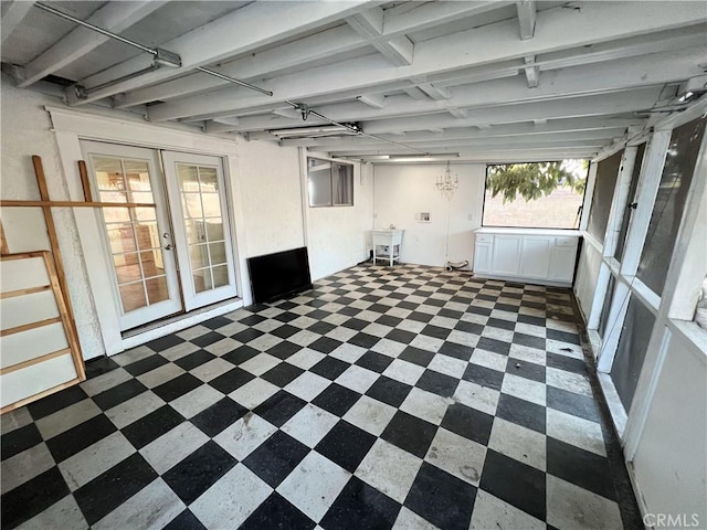 unfurnished sunroom featuring french doors and sink