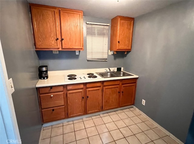 kitchen featuring sink and light tile patterned floors