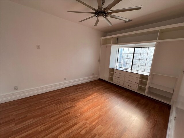 unfurnished bedroom featuring ceiling fan and wood-type flooring