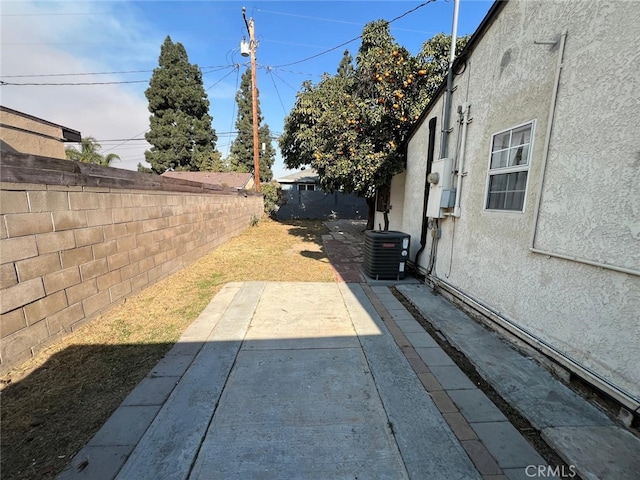 view of yard with a patio and central AC