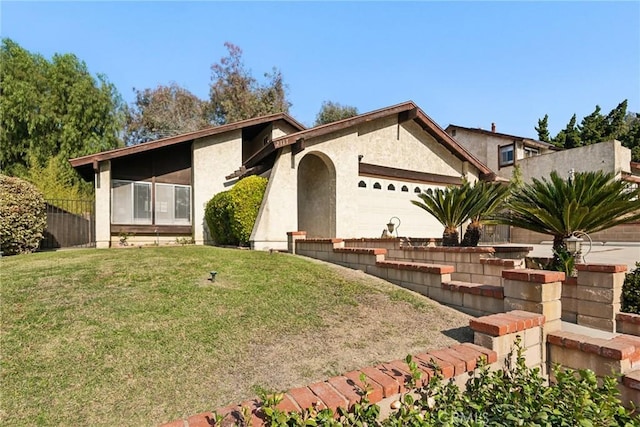 single story home with a garage and a front yard