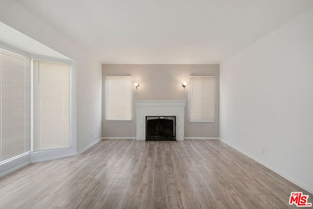 unfurnished living room featuring light hardwood / wood-style flooring