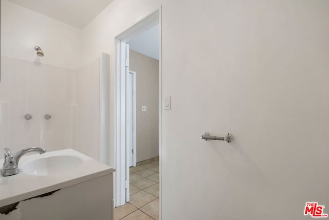 bathroom featuring sink and tile patterned flooring