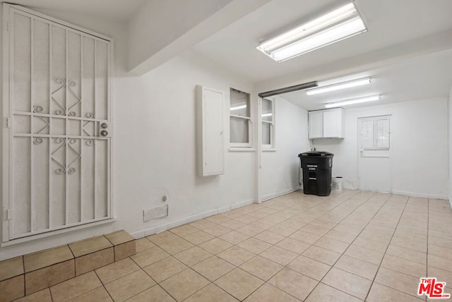 spare room with light tile patterned floors