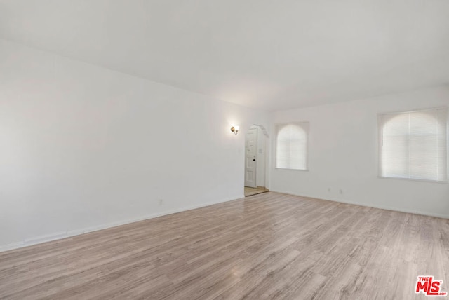 spare room with light hardwood / wood-style flooring